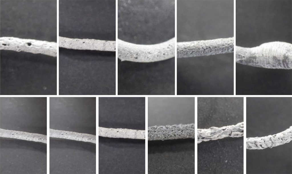 Fig. 16 Parameter testing with filament extruder setup for filament F1 and a nozzle of 0.8 mm. Top image: T = 250 °C, Extrusion Speeds from left to right: 7 mm/s [0.88 mm³/s], 14 mm/s [1,76 mm³/s], 42 mm/s [5.3 mm³/s], 70 mm/s [8.8 mm³/s], 98 mm/s [12,37 mm³/s]. Bottom image: 14 mm/s extrusion speed, temperatures extruded at 14 mm/s from left to right: 225°C, 235°C, 250°C, 270°C, 280°C, 290°C [3]