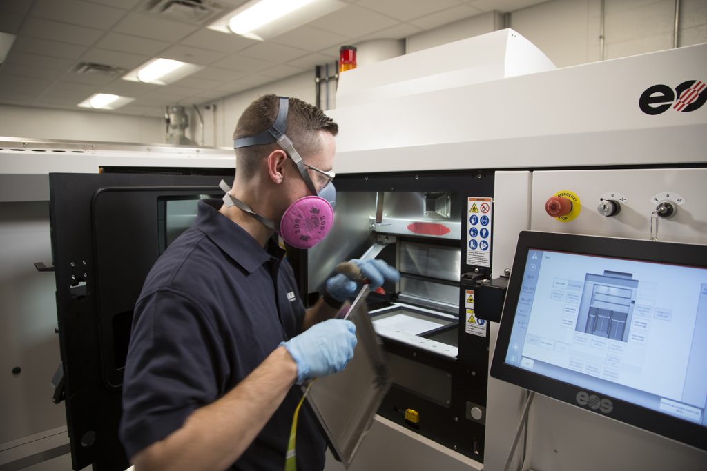 Fig. 1 Machine preparation at the Additive Manufacturing laboratory at Praxair