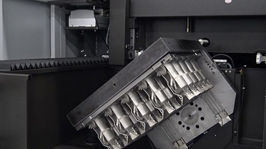 Fig. 4 Once loaded, the CUT AM 500 table inverts the build plate safely into the cutting position