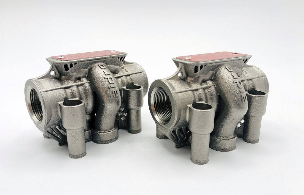 Fig. 7  Small AMES valves for hydraulic systems. AMES are CETOP directional control valves, here additively manufactured in 316L stainless steel and designed to work at 350 bar. These AM valves underwent high-pressure testing up to 1,400 bar (Courtesy Aidro)
