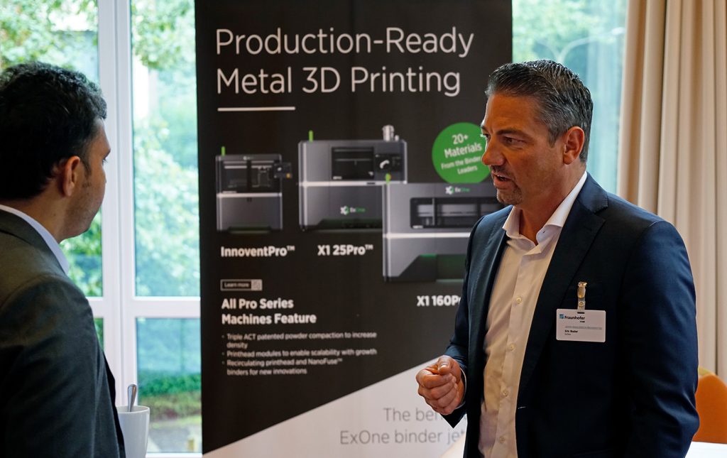 ExOne's Eric Bader discusses Binder Jetting technology with a workshop participant