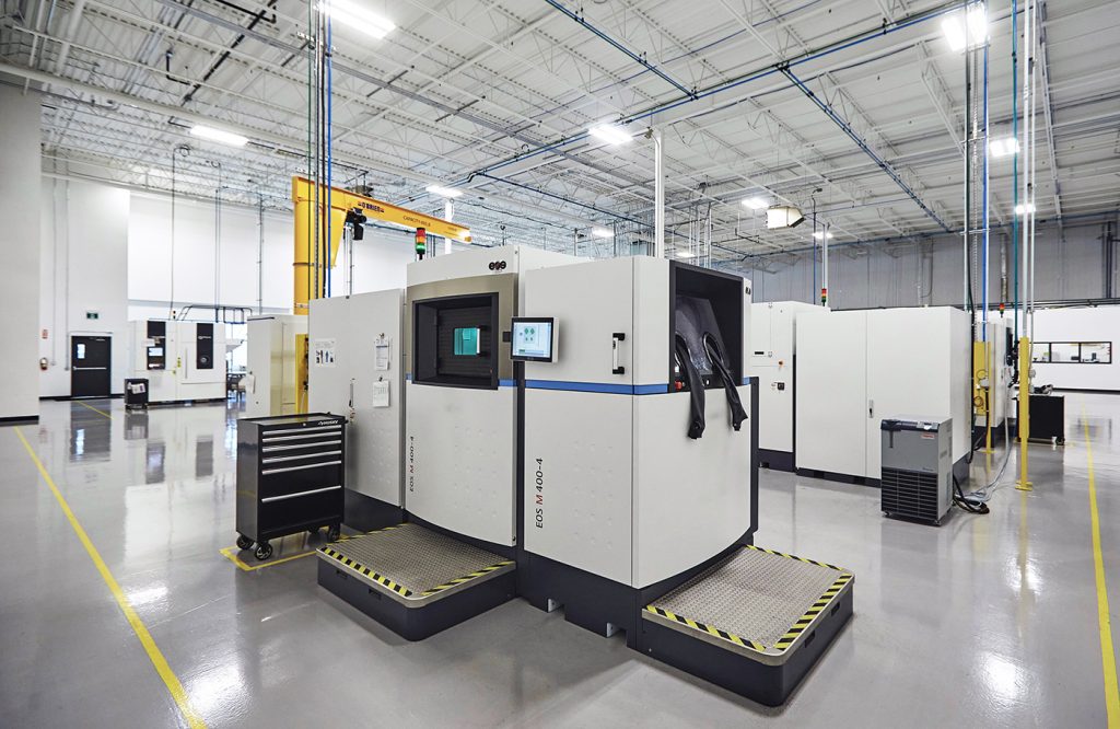 Whilst larger format PBF-LB machines such as these EOS M 400 4 quad laser machines bring enhanced build speeds, post-processing remains a challenge when looking to scale production (Courtesy Burloak Technologies)