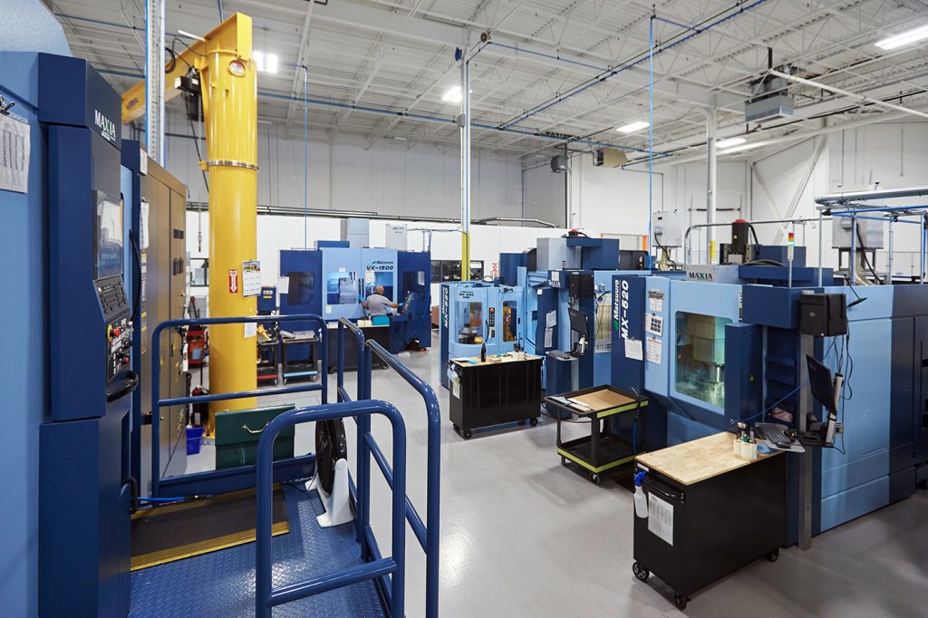 A bay of CNC machines for the post-processing of AM parts (Courtesy Burloak Technologies)
