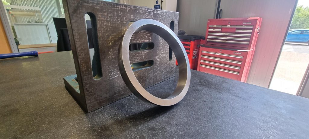 Fig. 2 The completed DED-LB wear ring, with the as-built ring shown inset (Courtesy NMIS and Eifeler - Voestalpine)