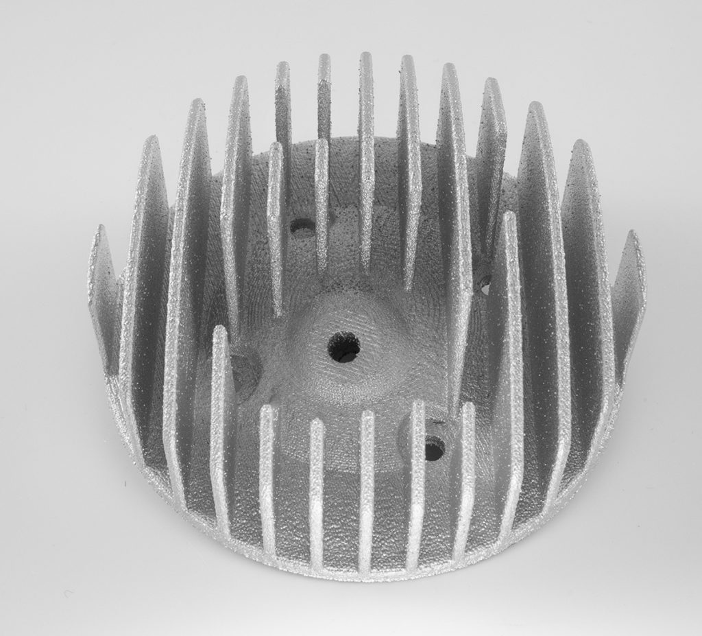 Fig. 7 A heat transfer cylinder head weighing 563 g with a 8:16 build time and dimensions of 139 x 140 x 61 mm (Courtesy Xerox)