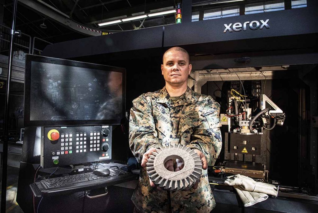 Fig. 9 Major Stephen Strieby with an ElemX machine installed at the Naval Postgraduate School (NPS), Monterey, California, USA (Photo Javier Chagoya)