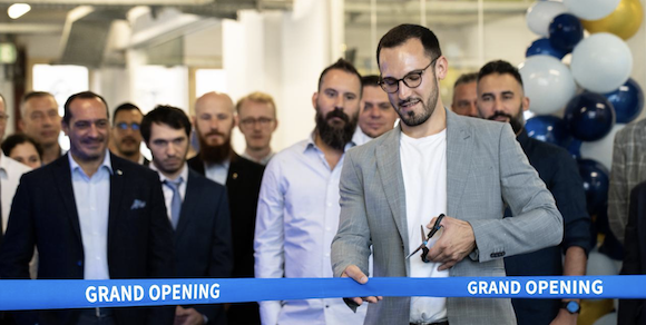 Enis Jost, Deputy General Manager, Eplus3D’s cuts the ribbon at the opening of Eplus3D’s European office for 3D printing (Courtesy Eplus3D)