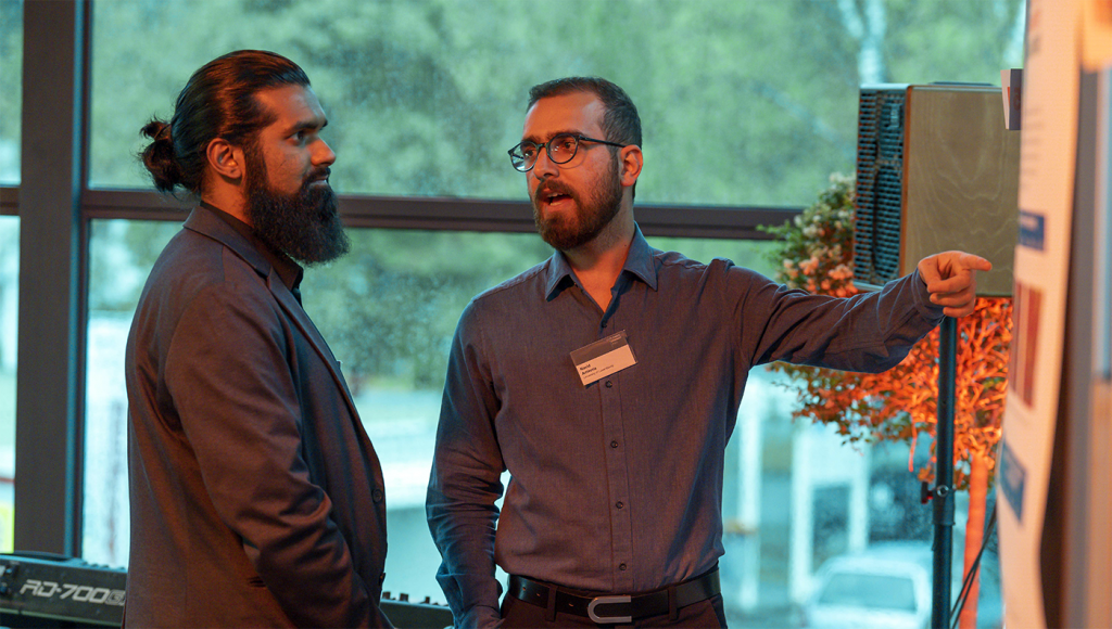 Fig. 3 Doctoral candidates from the University of Luxembourg Muhammed Mashhod (L) and Navid Amin Nia (R), presented their findings on Finite Element Modelling and Computation Fluid Dynamics/XDEM models, respectively (Courtesy Plansee) 