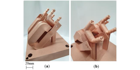 Examples of pure Cu coil winding and incorporated Triply Periodic Minimal Surface heat exchanger samples, where (a) displays the coil winding structure and (b) displays heat exchanger with internal TPMS structures (Courtesy Robinson, John et al, ‘Electrical Conductivity of 3D printed Copper and Silver for Electrical Winding Applications’, Materials)
