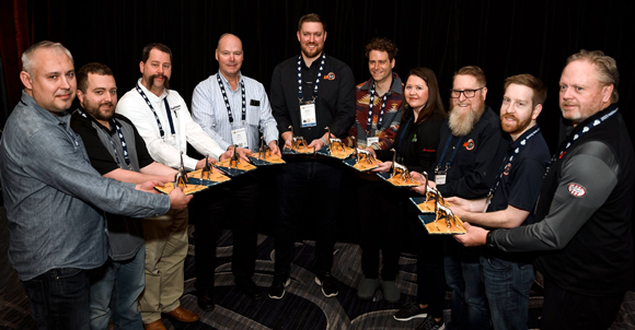 DINO Awards were presented to (from left) Bogdan Filipkowski, Matthew Mitchell, Dave Rittmeyer, Rob Hassold, Colton Rooney, Danny Levy, Heather Natal, Tim Bell, Alex Roschli, and Roger Nielsen (Courtesy AMUG)