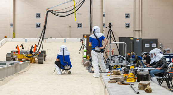 NASA's Volatiles Investigating Polar Exploration Rover conducts mobility testing at NASA Glenn's Simulated Lunar Operation Laboratory (Courtesy Bridget Caswell/Alcyon Technical Services, LLC)