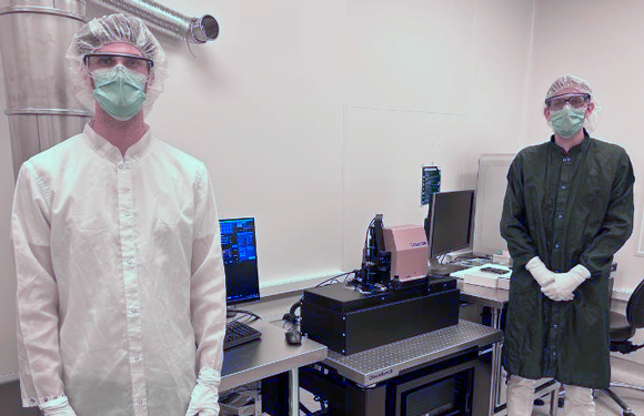 Nikolas Roeske, Process Equipment Engineer at Georgia Tech, and Riccardo Conte, Exaddon R&D Engineer, standing next to the CERES additive manufacturing system (Courtesy Exaddon)