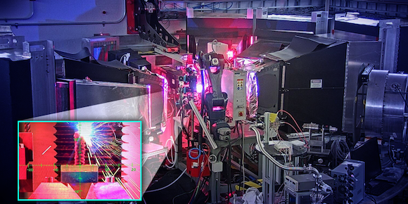 The OpeN-AM experimental platform, installed at the VULCAN instrument at ORNL’s Spallation Neutron Source, features a robotic arm that prints layers of molten metal to create complex shapes (Courtesy Jill Hemman, ORNL/US DOE)