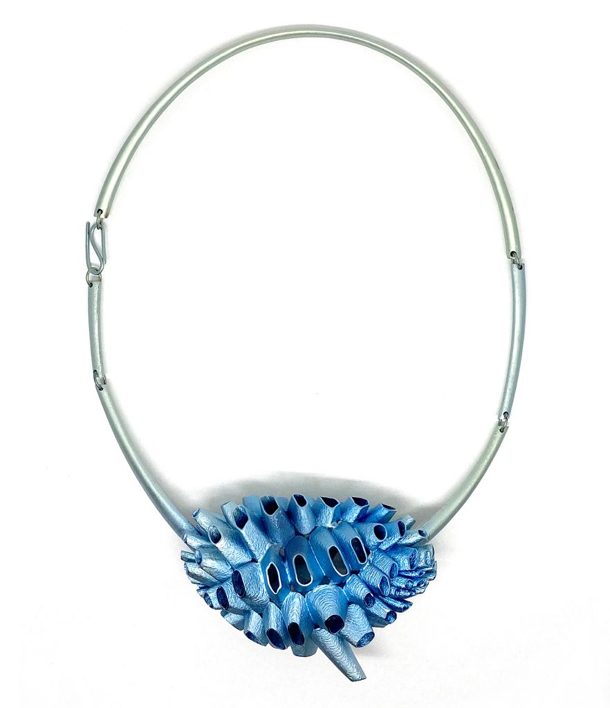 Fig. 4 'Concretiones 46' necklace (2020), designed by Stefania Lucchetta. The material is anodised titanium. Laser Beam Powder Bed Fusion (PBF-LB)
was the primary technology used, and the piece is hand finished using sandblasting and polishing (Courtesy Stefania Lucchetta)