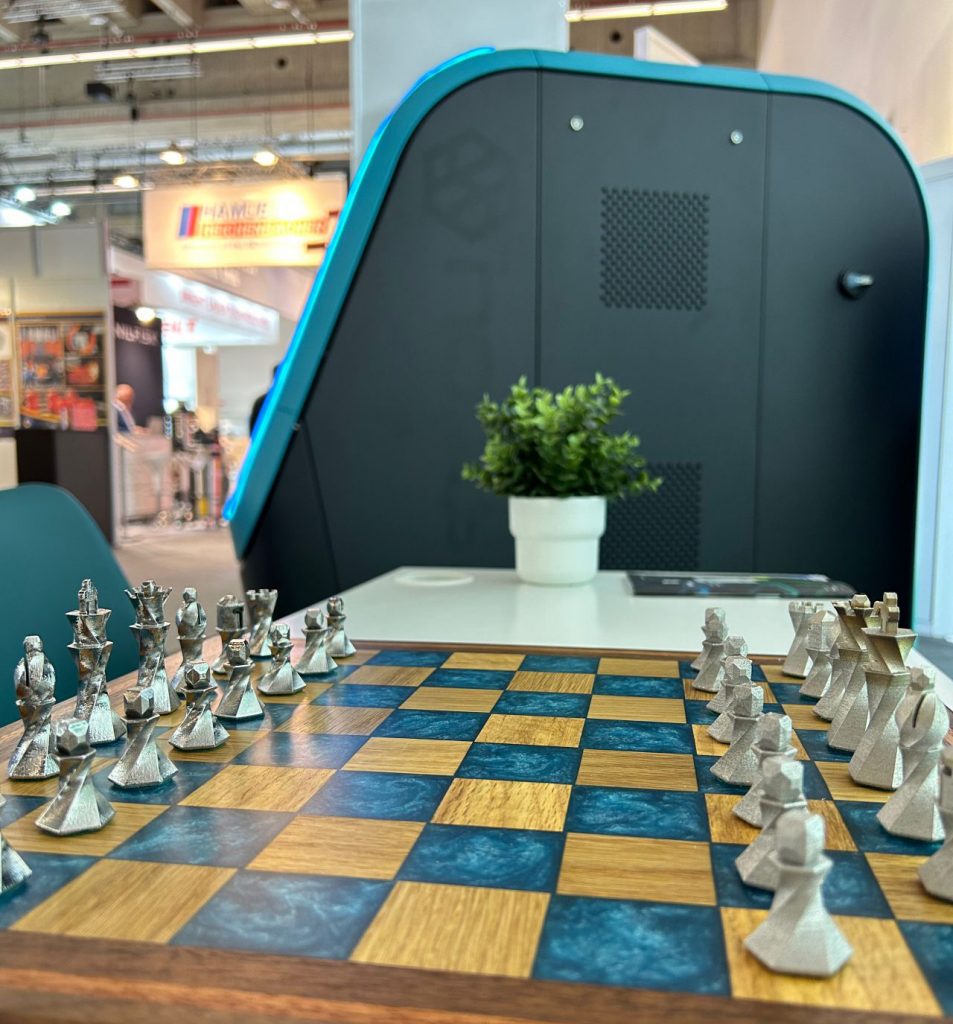 Fig. 16 The electroform surface finishing machine from Holdson and some surface finished chess pieces (Courtesy Holdson)