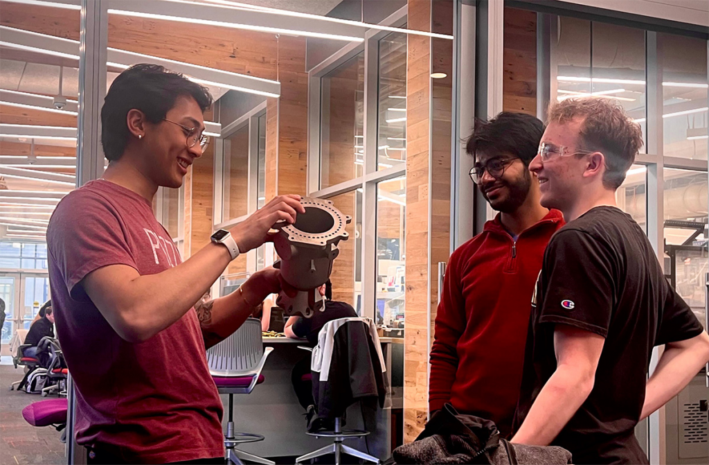 PSP-AC's Alex Suppiah (left), Yash Amin (centre), and Andrew Radulovich (right) discuss the AM part (Purdue University)