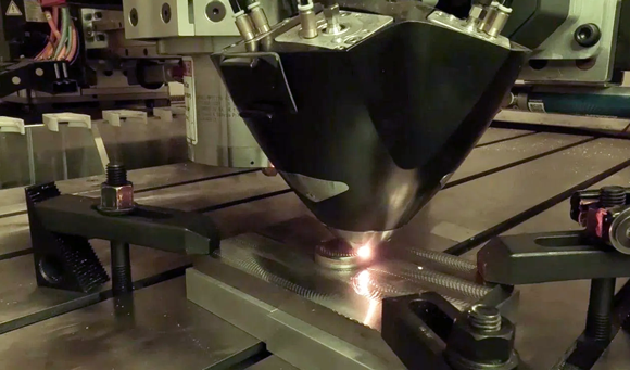 Meltio’s hybrid metal process integrates additive and subtractive manufacturing into one single system. Seen here is the additive process, producing the part for the USS Somerset (Courtesy Meltio)