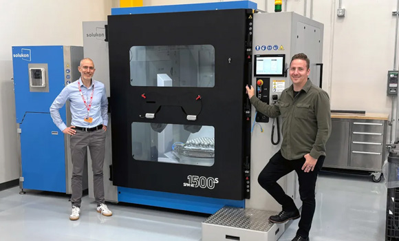 Andreas Hartmann, CEO/CTO of Solukon and Joshua Forster, Production Manager at Nikon SLM Solutions in front of the SFM-AT1500-S (Courtesy Solukon)