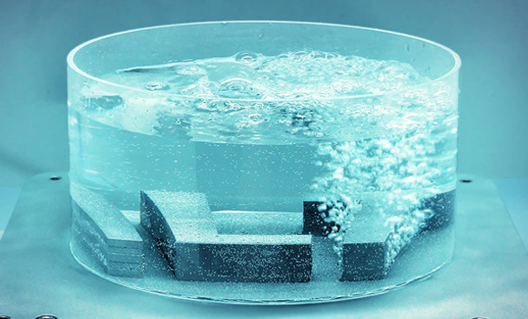 Demonstration of the Additive Manufacturing of porous structures: The metallic logo of the Fraunhofer ILT illustrates the adjustable permeability through integrated porous zones (Courtesy Fraunhofer ILT)