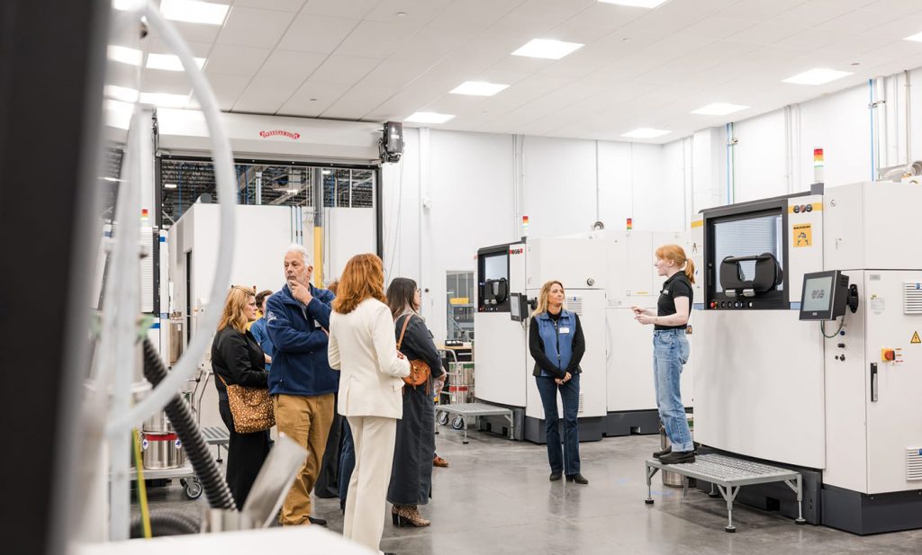 Fig. 7 European metal AM technology, this time from EOS, on show at Beehive Industries during the opening of its new 5,500 m2 headquarters in Centennial, Colorado (Courtesy Beehive Industries)