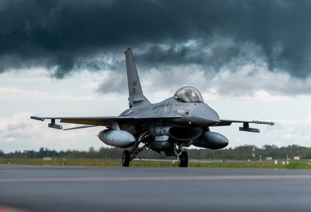 Fig. 1 A Portuguese Air Force fighter pilot taxis for take-off in an F-16 Fighting Falcon during a Baltic Air Policing Rotation in Estonia (Courtesy NATO)