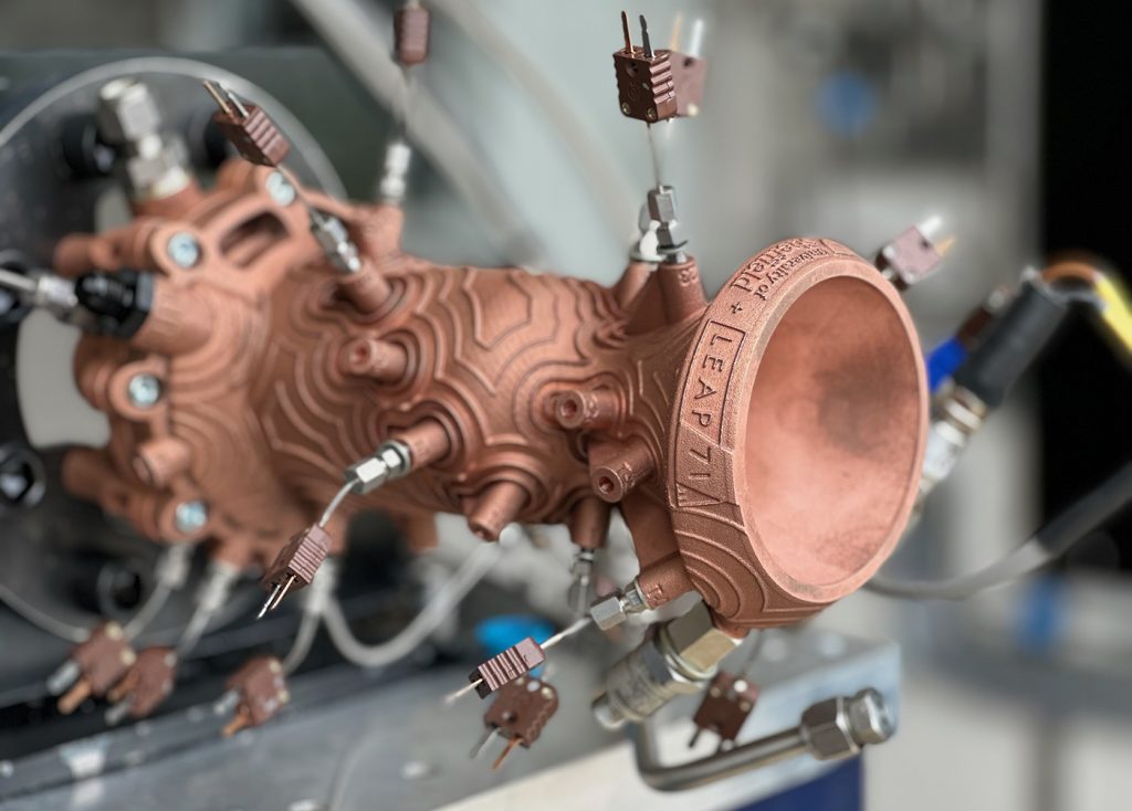 Fig. 4 Noyron TKL-5 thruster, producing 5,000 N of thrust and powered by kerosene and cryogenic liquid oxygen. Additively manufactured from CuCrZr by AMCM (Courtesy LEAP 71)