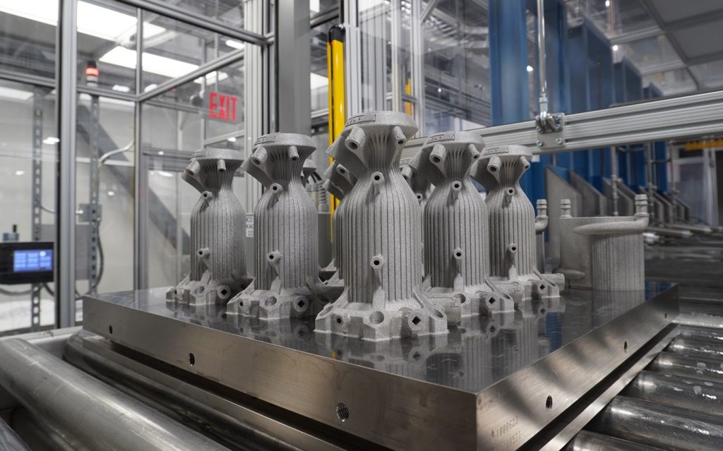Fig. 6 Production batch of 2,000 N rocket thrusters, manufactured by VulcanForms (Courtesy VulcanForms)