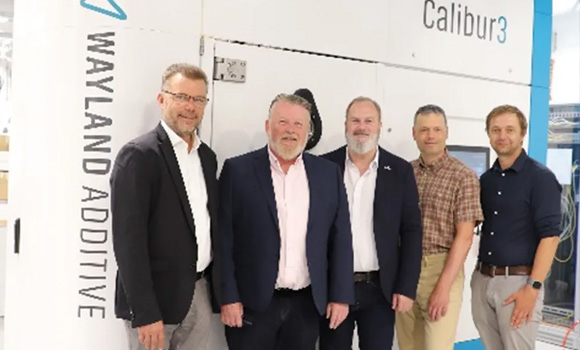 From left to right: Thomas Weissgärber (Director Fraunhofer IFAM Dresden), Darrin Dickinson (Head of Business Development Europe, Wayland Additive), Peter Hansford (Chief Revenue Officer, Wayland Additive), Alexander Kirchner (Project Manager PDF-EB, Fraunhofer IFAM Dresden), Kay Reuter (Head of Department Additive Manufacturing, Fraunhofer IFAM Dresden) in front of the newly installed Wayland Calibur 3 (Courtesy Wayland Additive)