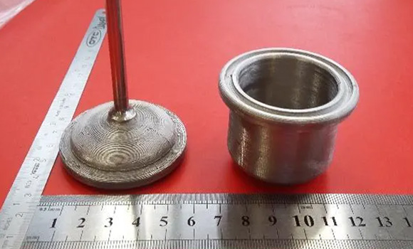 Additively manufactured reactor vessel with a welded gas exhaust tube (Courtesy Nanoe)