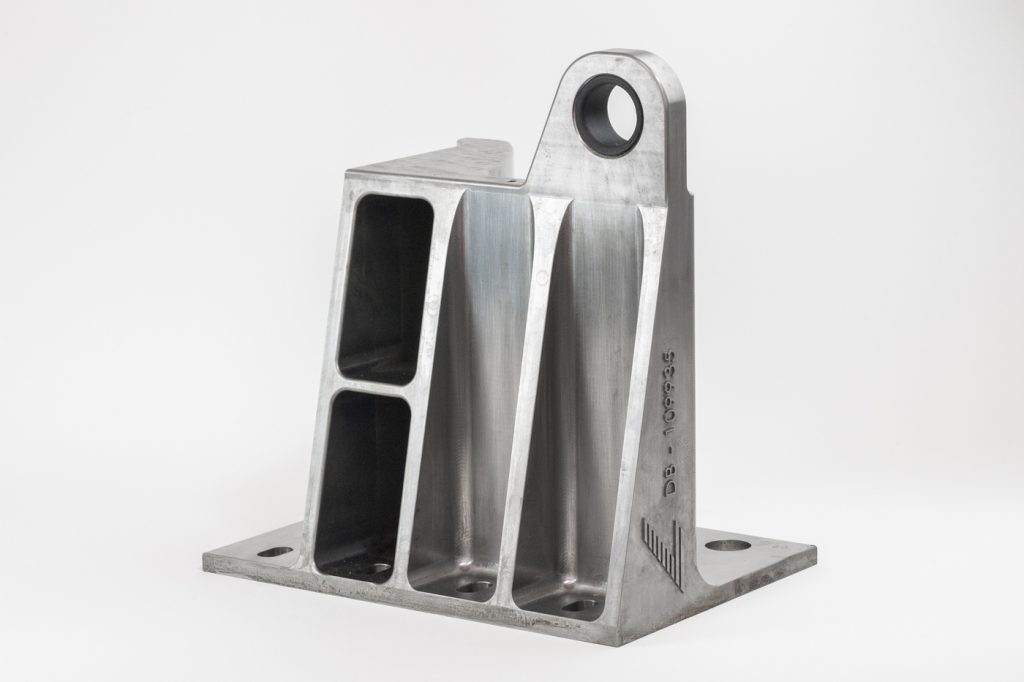 Fig. 7 A 27 kg box frame, produced by metal Additive Manufacturing. The part ensures that rail cars run safely around tilt bends (Courtesy Deutsche Bahn AG)