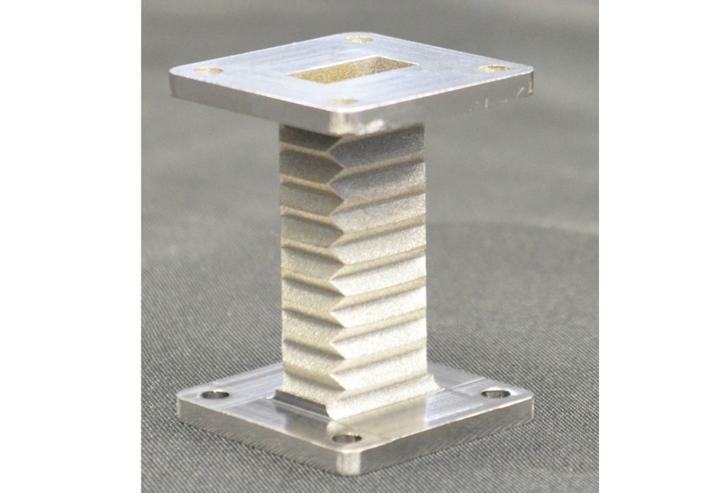 Fig. 13 Compliant AM shape-memory alloy NiTi microwave waveguide prototype. Rectangular cavity section dimensions: 8 x 16 x 38 mm (Courtesy of the authors/Penn State, supported by NASA SST programme)