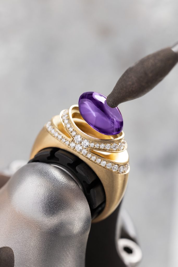 Fig. 4 Bulgari’s renowned Cabochon ring reimagined using metal Additive Manufacturing. The ring shown, in yellow gold, features a cabochon-cut amethyst, surrounded by diamonds (Courtesy Bulgari)