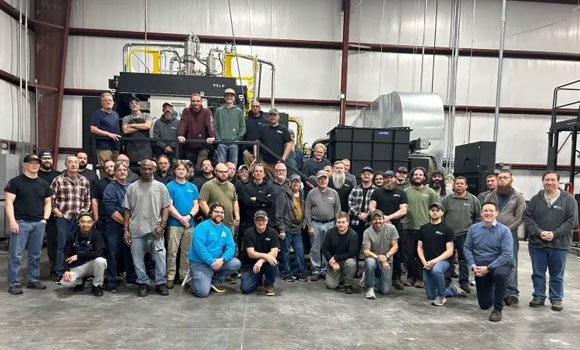 The team at Mears Machine Corporation in front of the Velo3D Sapphire XC Additive Manufacturing machine (Courtesy Mears Machine Corporation)