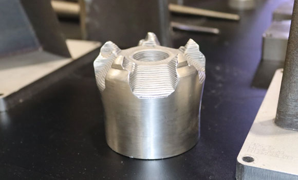 Mining drill head repaired using wire-based Laser Metal Deposition (Courtesy Welding Alloys)