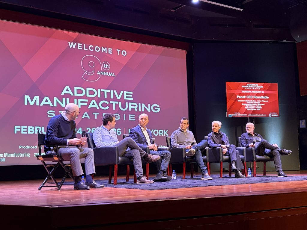 Fig. 7 Left to right: Stephan Bulkow (Cantor Fitzgerald), Max Lobovsky (Formlabs), Yoav Zeif (Stratasys), Phil DeSimone (Carbon), Brigitte de Vet-Veithen (Materialise), and Glynn Fletcher (EOS) during the CEO Roundtable at Additive Manufacturing Strategies 2026 in New York. (Courtesy Additive Manufacturing Strategies)