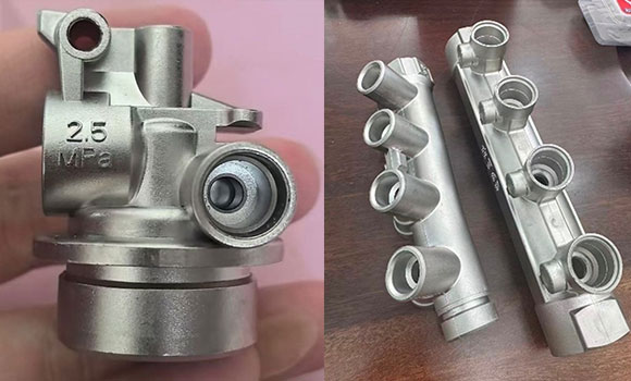 The article showcased examples of MIM-produced components, including (left) this fire extinguisher valve and (right) multi-port manifold (Courtesy Dr Q)