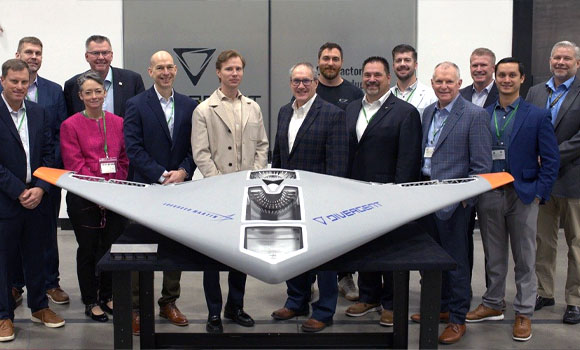 Leaders from Lockheed Martin and Divergent stand behind the Replicator prototype that the companies created together (Courtesy Lockheed Martin)