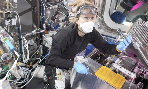 ESA astronaut Sophie Adenot showing the fifth additively manufactured sample to the ground teams (Courtesy ESA)