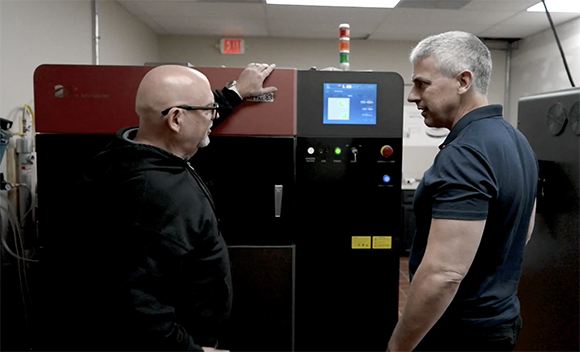 Manufacturing Unlimited, hosted by manufacturing journalist Peter Zelinski, examines how Additive Manufacturing and other advanced manufacturing technologies are being implemented in production environments (Still courtesy The Zelinski Report/YouTube)