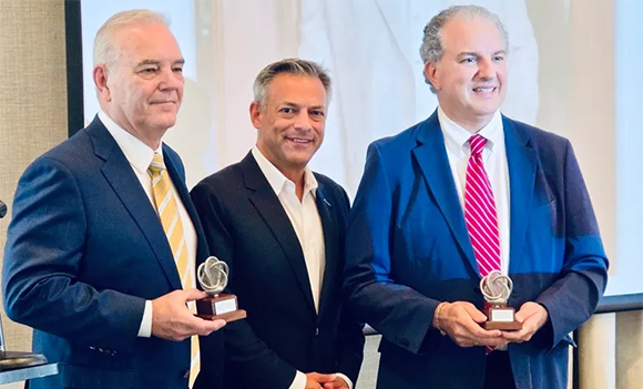 Neal Orringer, President of ASTRO America (centre), presents metal AM trophies to Rep Jimmy Patronis (R-Fla, right) and Charles W Rigdon, Chair of Triumph Gulf Coast (left), in recognition of their contributions to Northwest Florida’s aerospace and defence industry (Courtesy ASTRO America)