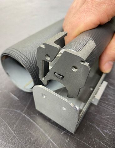 The original polymer latch was redesigned in Ti6Al4V (Courtesy Materialise)