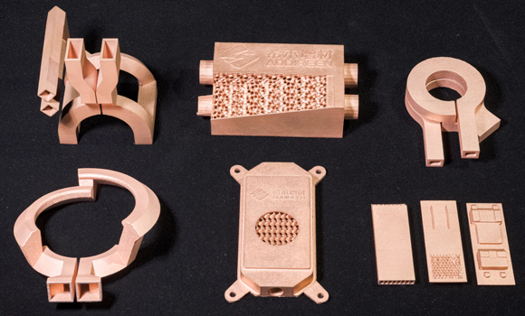 Typical pure-copper and copper-alloy applications: liquid cold plates, heat exchangers, optical-transceiver heat sinks, induction coils and aerospace combustion chambers with integrated cooling channels (Courtesy Addireen)