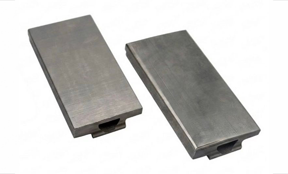 Finished flat and domed tungsten tiles with mirror-like plasma-facing surfaces, ready for installation in DIII-D (Courtesy North Carolina State University, Oak Ridge National Laboratory (ORNL) and JEOL)