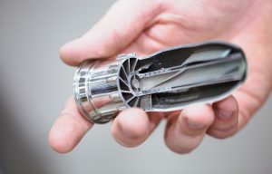 Fig. 4 AM allows engineers to manufacture objects with complex internal geometries that would be otherwise very difficult or expensive to achieve, such as this fuel nozzle (Images: GE Reports/Chris New)