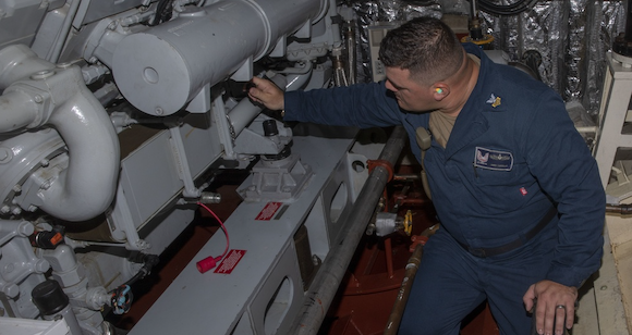 Engineman 1st Class Anier Carrillo checks the fitting of an additively manufactured valve aboard the USS Indianapolis (Courtesy Petty Officer 3rd Class Austin Collins)