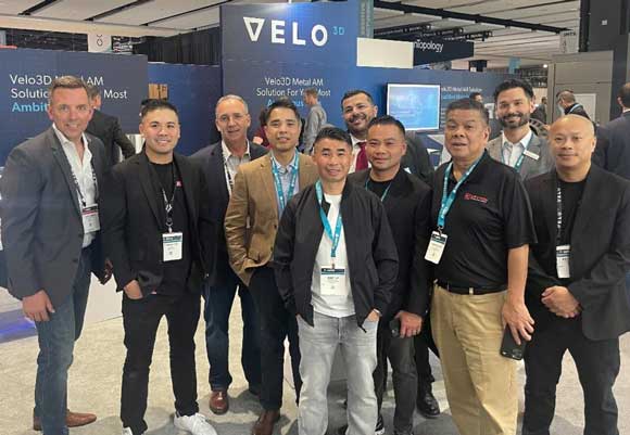 Kevin Nguyen, Kevton Technologies president (second from left) and his team with Velo3D staff at the Velo3D booth at IMTS 2022 (Courtesy Velo3D)