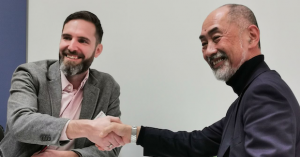 Dr Gerald Mitteramskogler, CEO, Incus, and Dr Shigeo Tanaka, CEO, Micro MIM Japan Holdings, shake hands at Formnext (Courtesy Micro MIM)