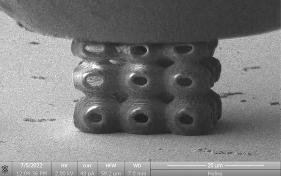 Image taken from a video showing the in-situ SEM compression of a nanocluster-polymer SP nanolattice (Courtesy Science)