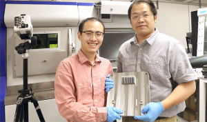 UVA materials science and engineering postdoctoral fellow Zhongshu Ren, left, and UVA associate professor Tao Sun display the results of their research (Photo by Tom Cogill for UVA Engineering)
