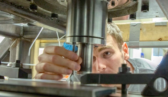 Greg Hahn readies a first-generation Additive Friction Stir Deposition machine for printing samples of high-strength aluminium used in aircraft, under a grant from the U.S. military. A Department of Defense grant will purchase a new cutting-edge machine for the university. (Courtesy Tonia Moxley for Virginia Tech)